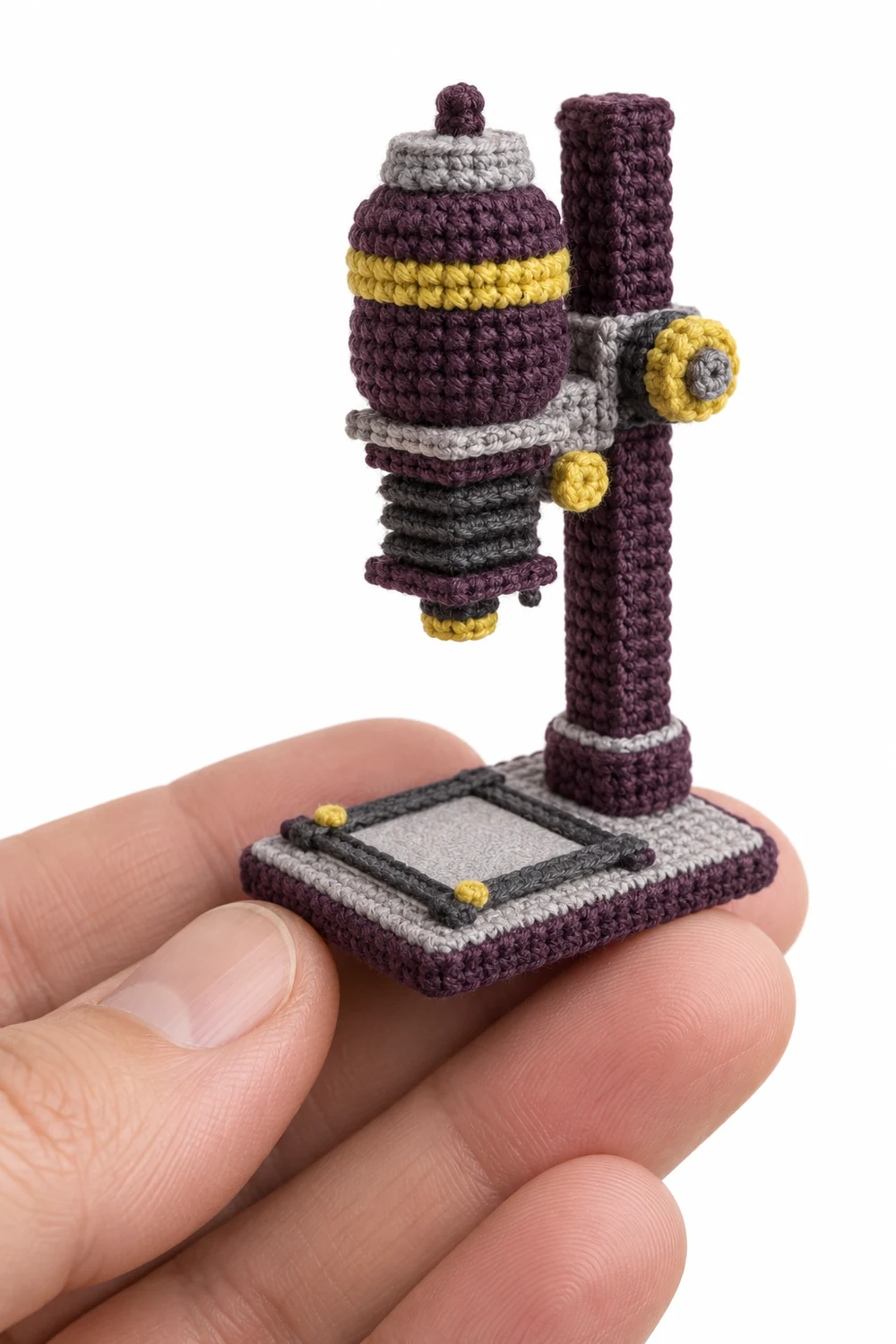 Aubergine miniature crochet photographic enlarger with square column