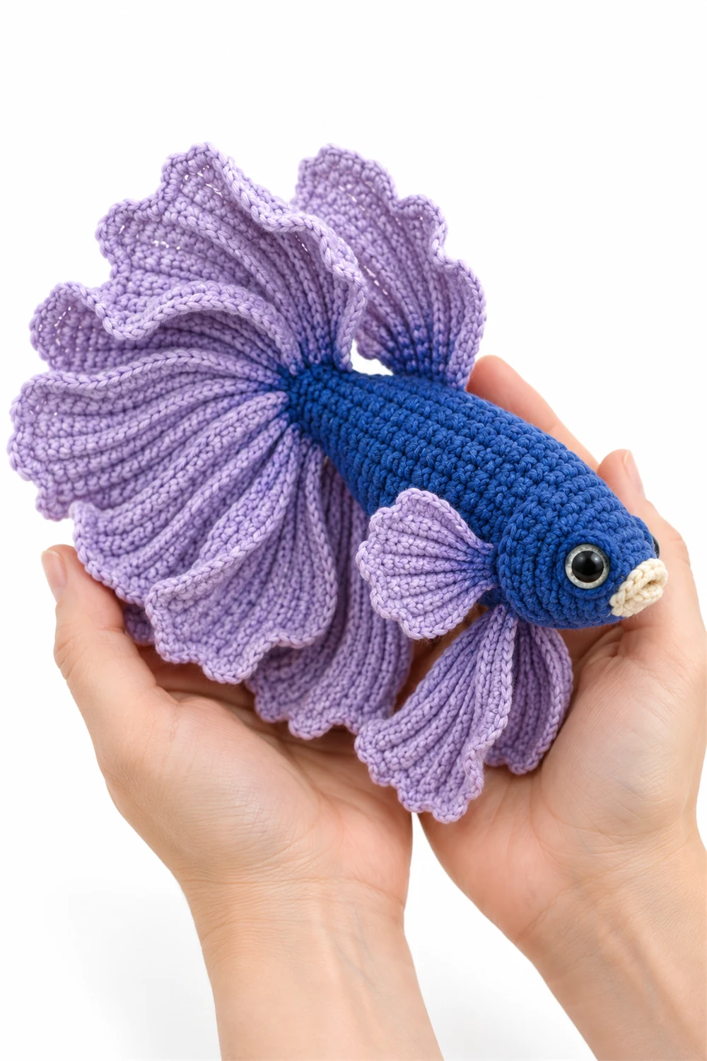 Blue crochet betta fish amigurumi with flowing fan fins