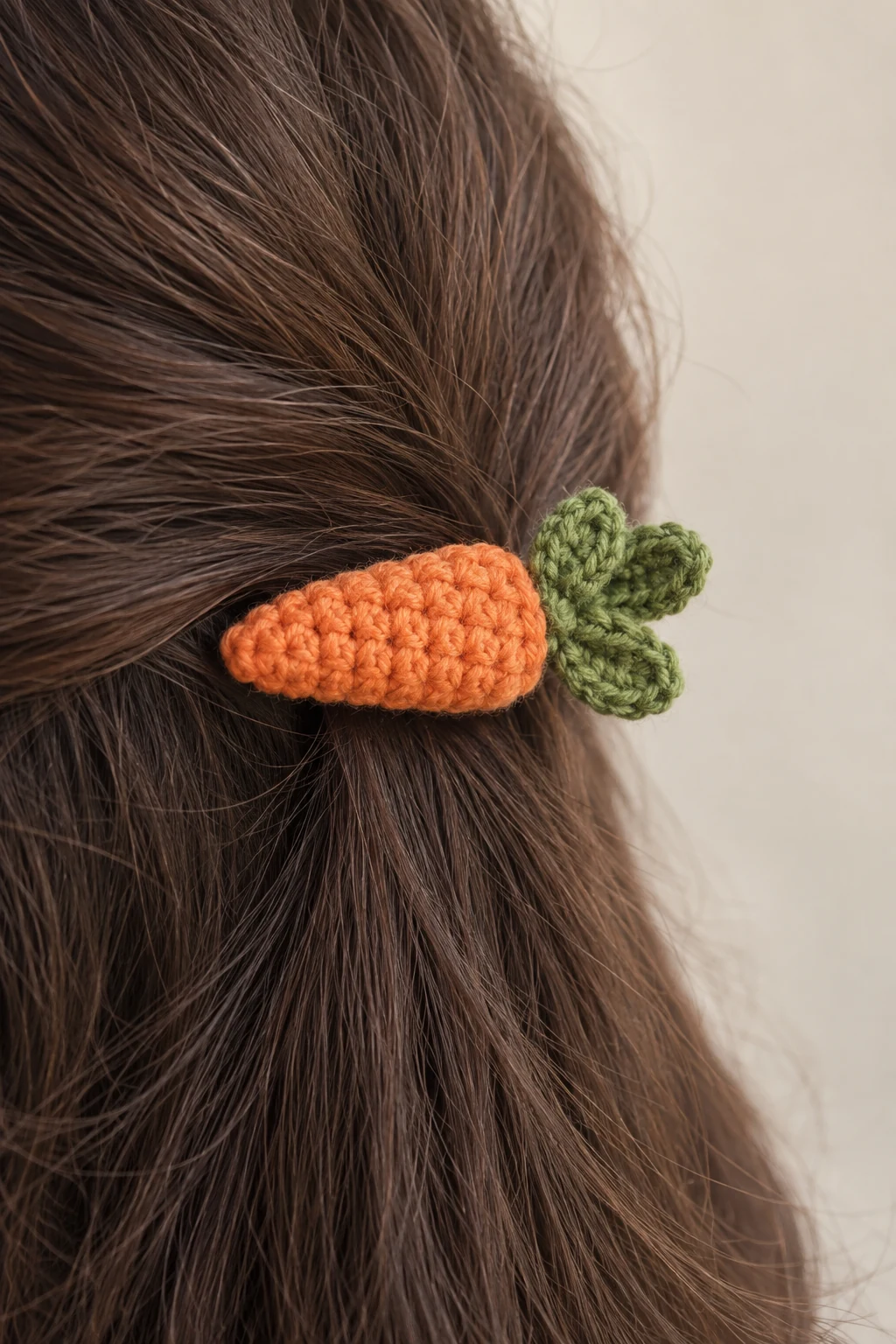 Orange crochet carrot hair clip with green leafy top