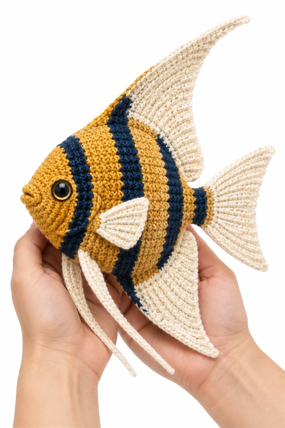 Golden crochet angelfish amigurumi with tall fins