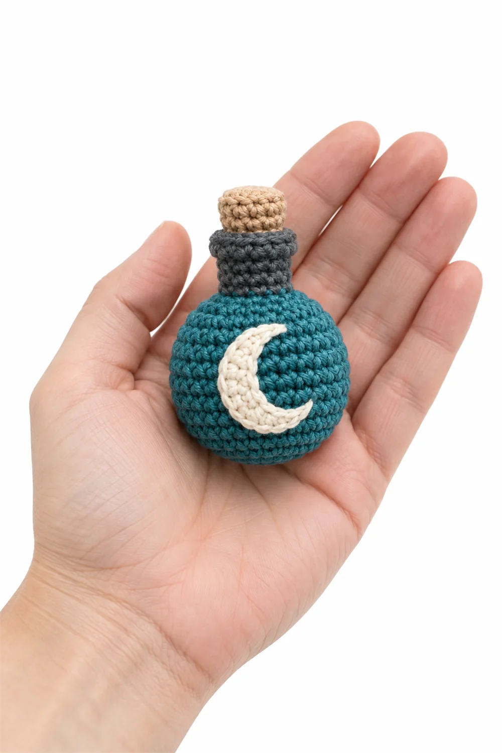 Crochet keychain shaped like a potion flask