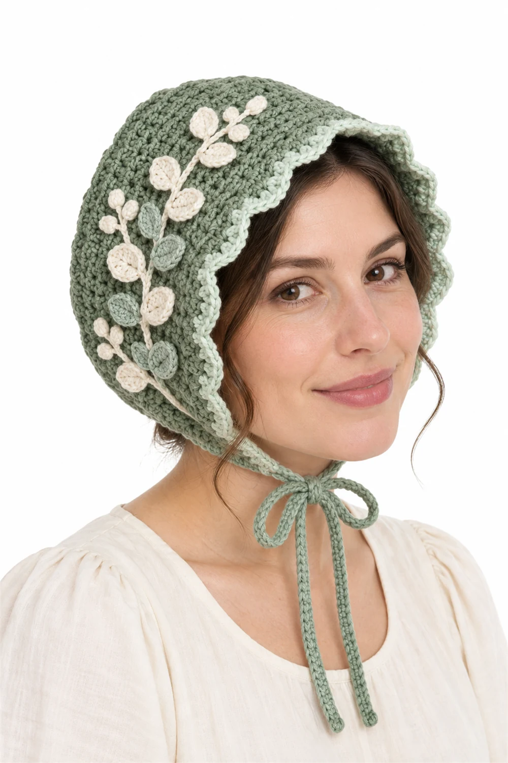 Sage green crochet bonnet with eucalyptus sprig trim